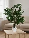 Planta Aralia Artificial en ambiente de salón moderno